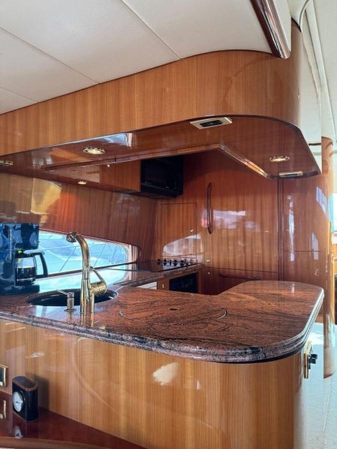 a kitchen with a wood stove aboard CLASSIFIED Yacht for Sale