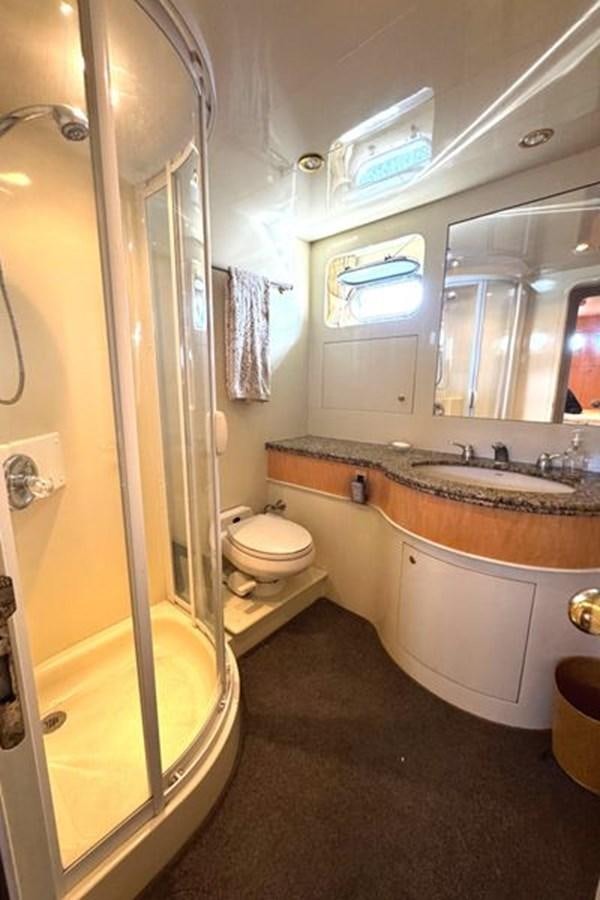 a bathroom with a sink toilet and bathtub aboard CLASSIFIED Yacht for Sale