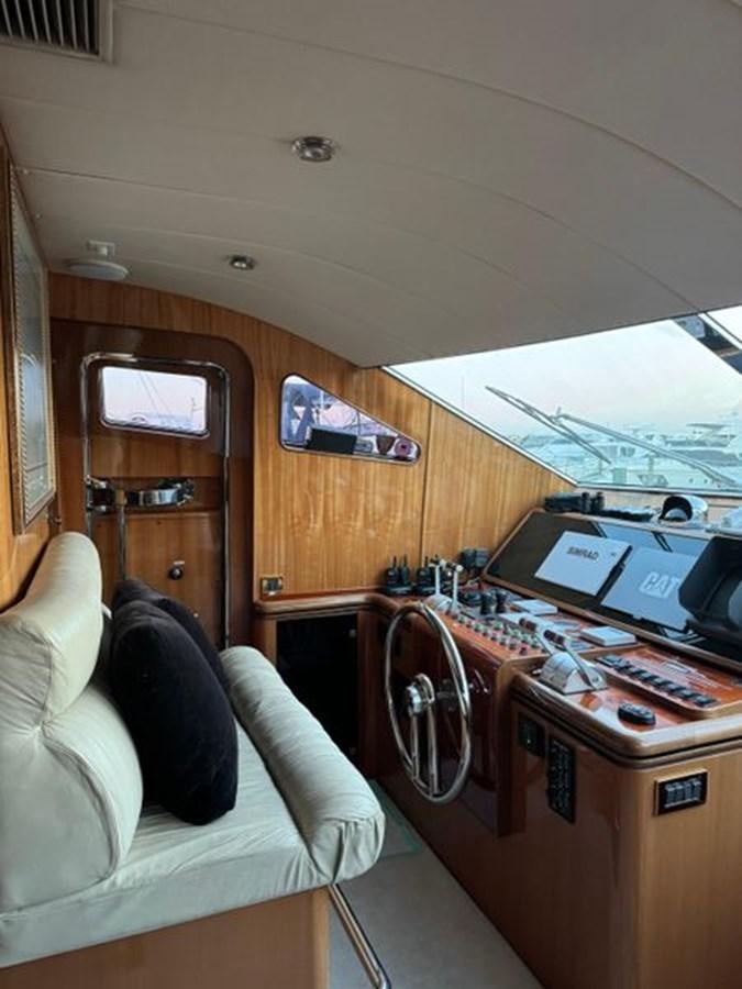 a room with a bed and a desk aboard CLASSIFIED Yacht for Sale