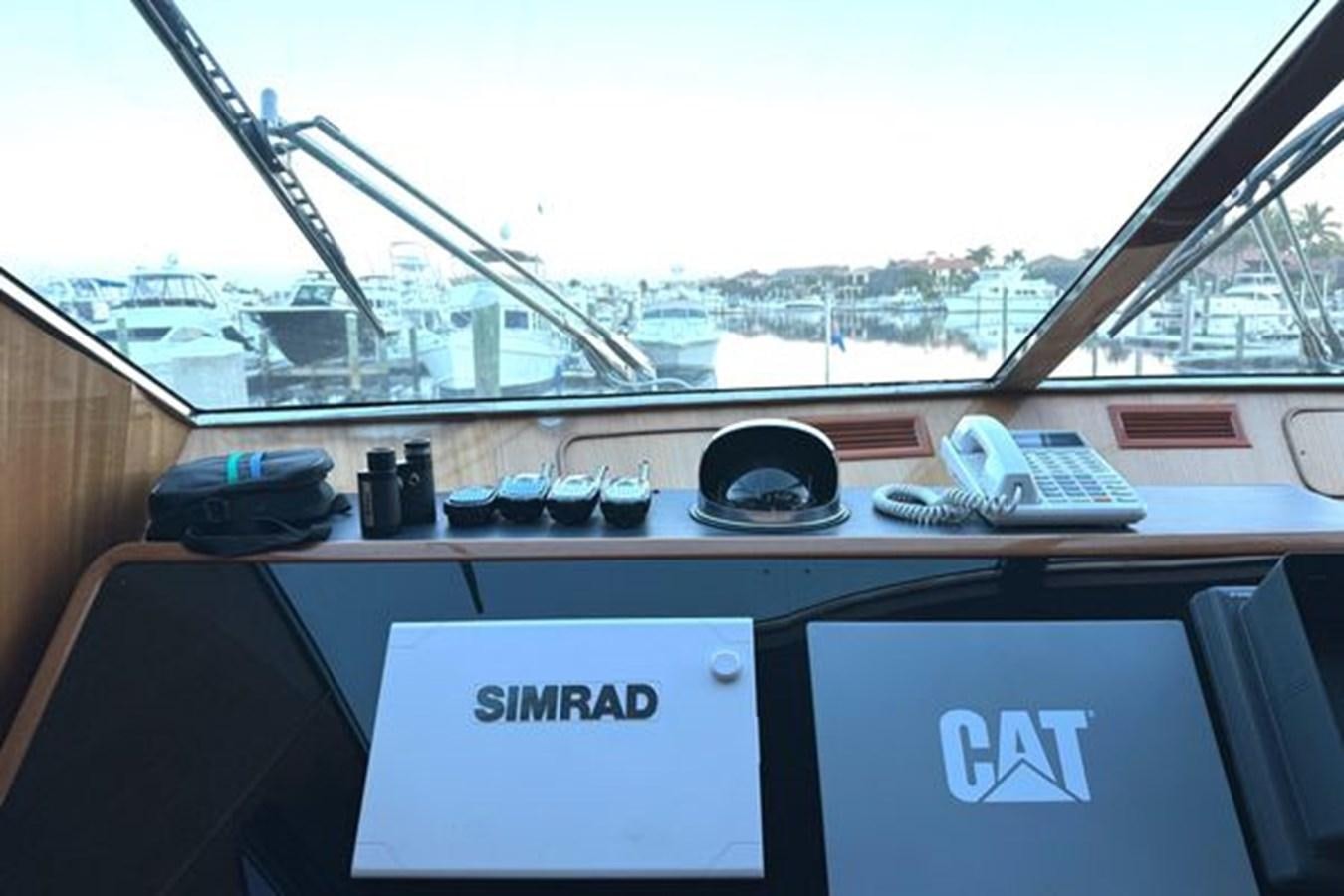 a desk with a computer and a keyboard on it aboard CLASSIFIED Yacht for Sale