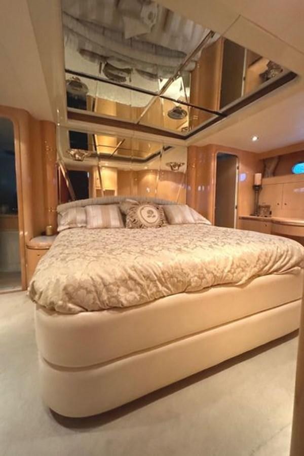 a bed with a large bed aboard CLASSIFIED Yacht for Sale