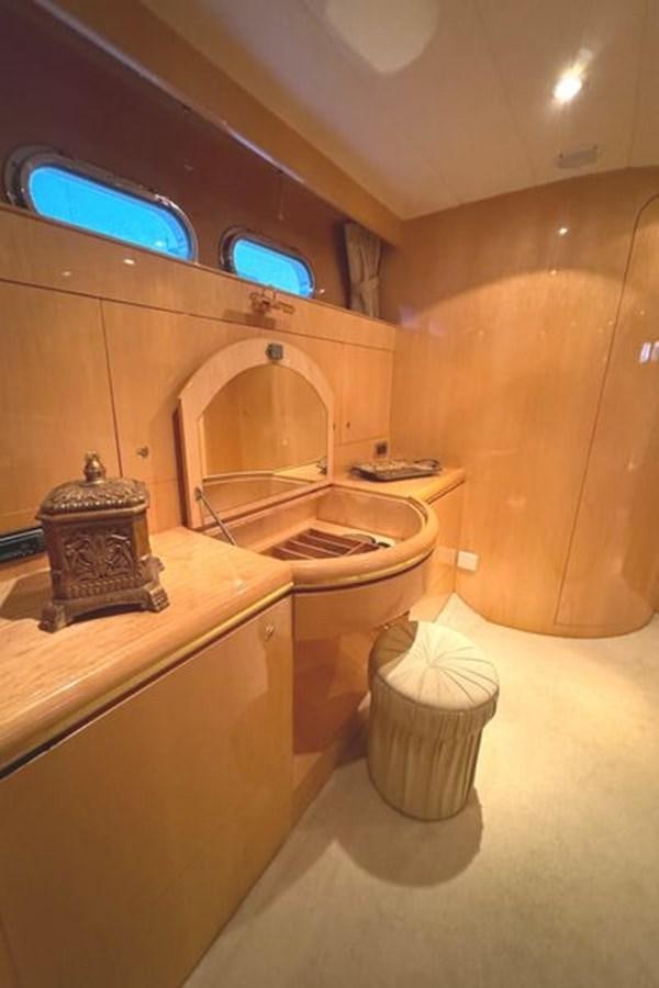 a bathroom with a large mirror aboard CLASSIFIED Yacht for Sale