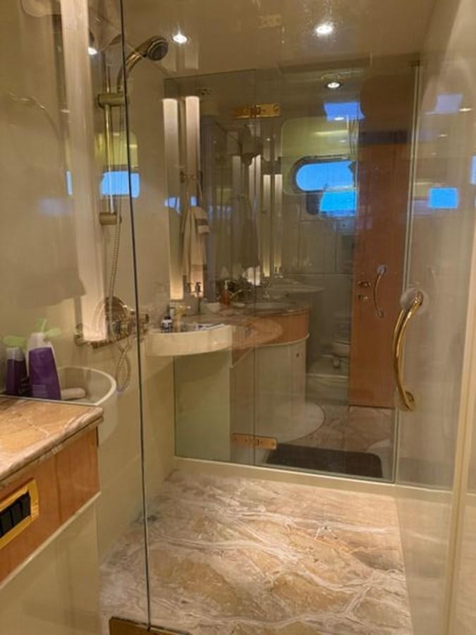 a bathroom with a glass shower aboard CLASSIFIED Yacht for Sale