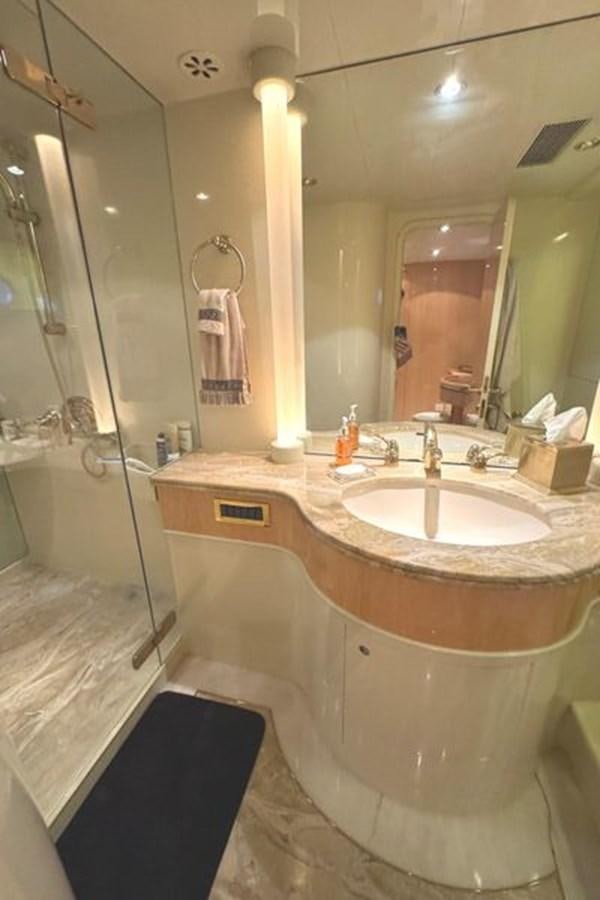 a bathroom with a sink and a shower aboard CLASSIFIED Yacht for Sale