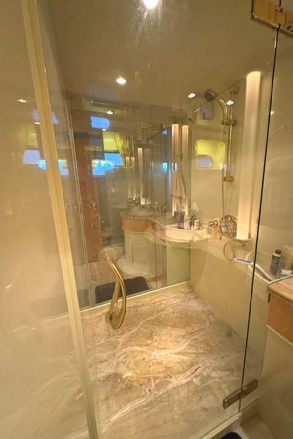 a bathroom with a large mirror aboard CLASSIFIED Yacht for Sale