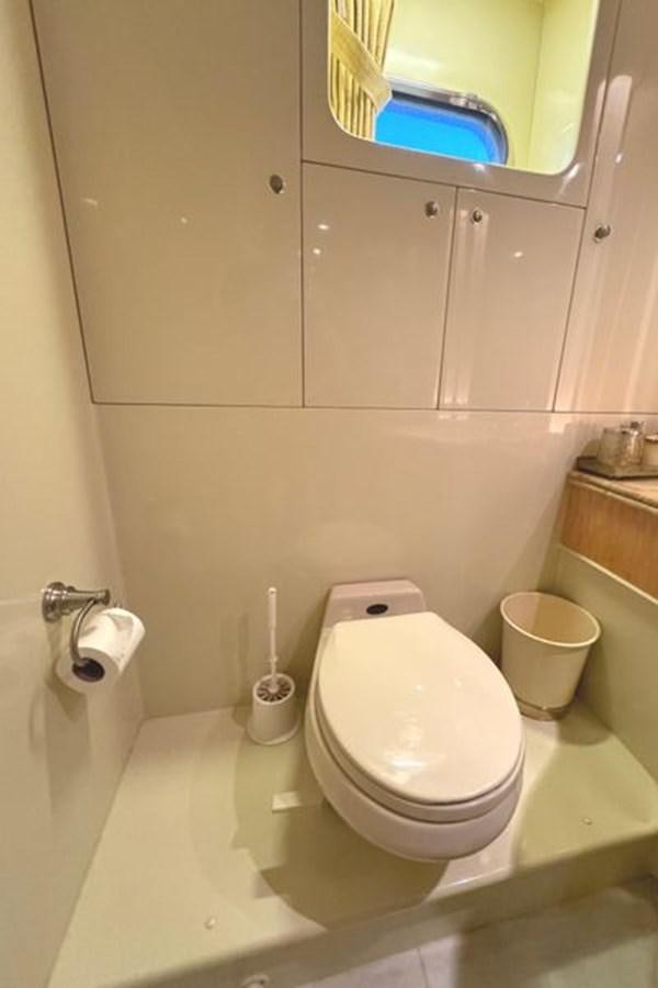 a toilet in a bathroom aboard CLASSIFIED Yacht for Sale