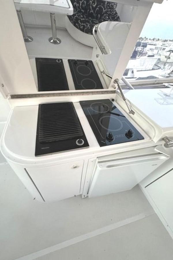 a white stove with a vent aboard CLASSIFIED Yacht for Sale