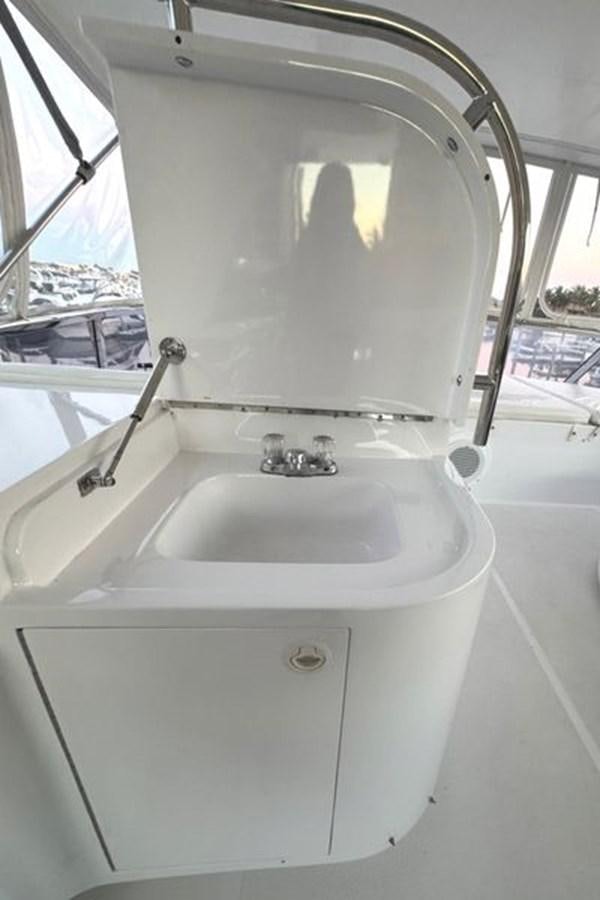 a sink with a large mirror aboard CLASSIFIED Yacht for Sale