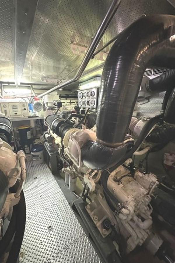 a car engine with a large metal pipe aboard CLASSIFIED Yacht for Sale