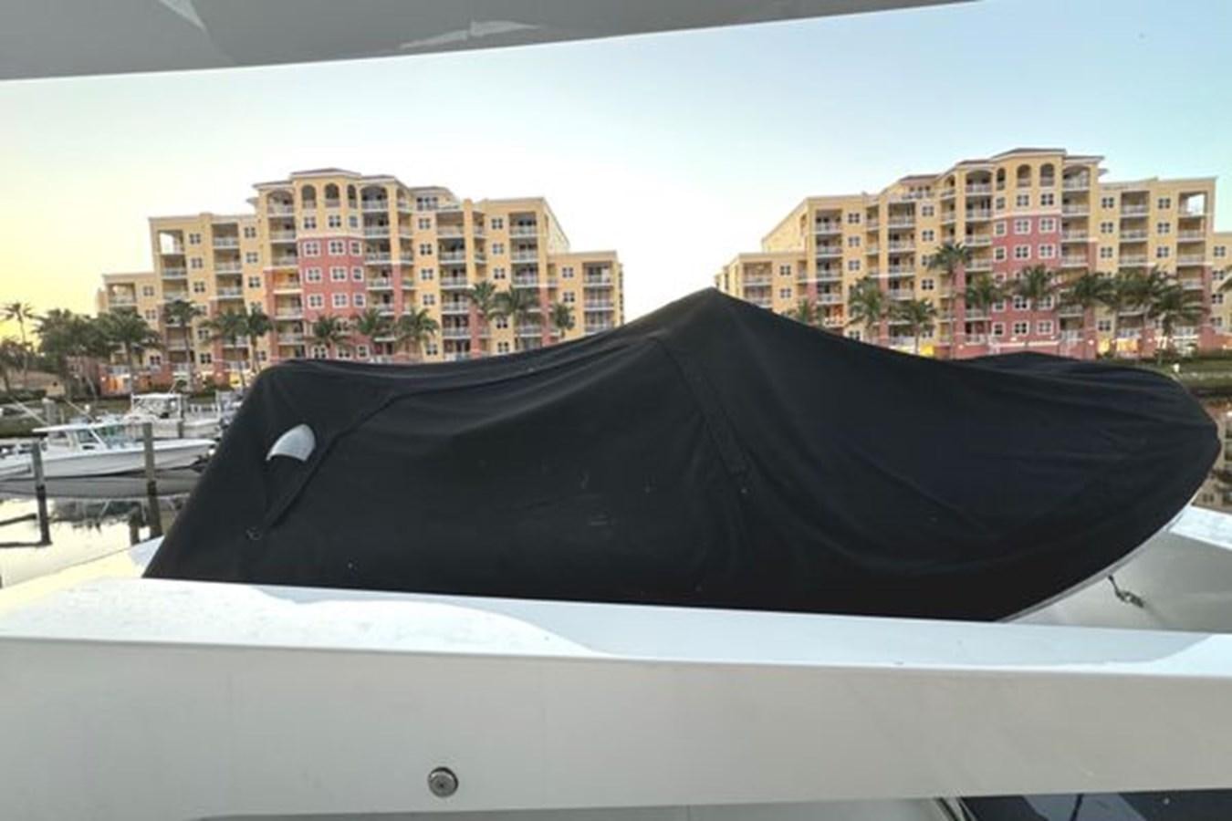 a black umbrella on a white surface aboard CLASSIFIED Yacht for Sale