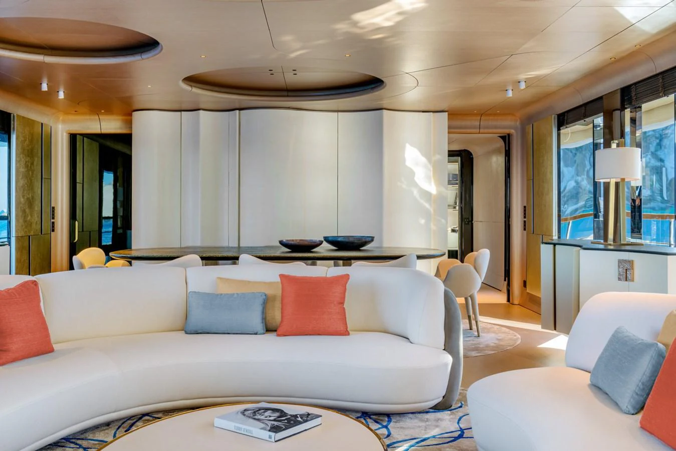 a living room with a white couch aboard CLUB M Yacht for Sale
