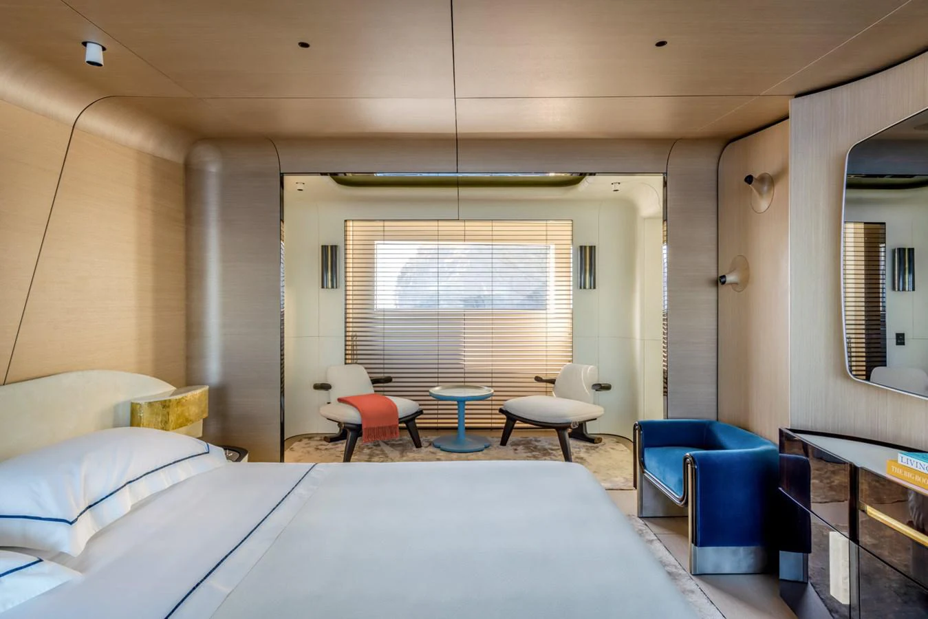 a room with a bed and chairs aboard CLUB M Yacht for Sale