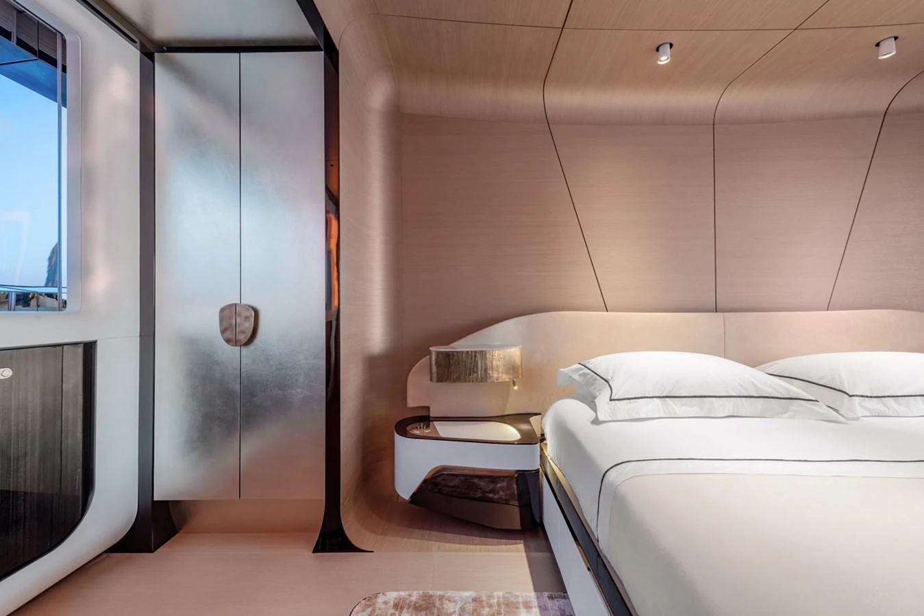a room with a bed and a mirror aboard CLUB M Yacht for Sale