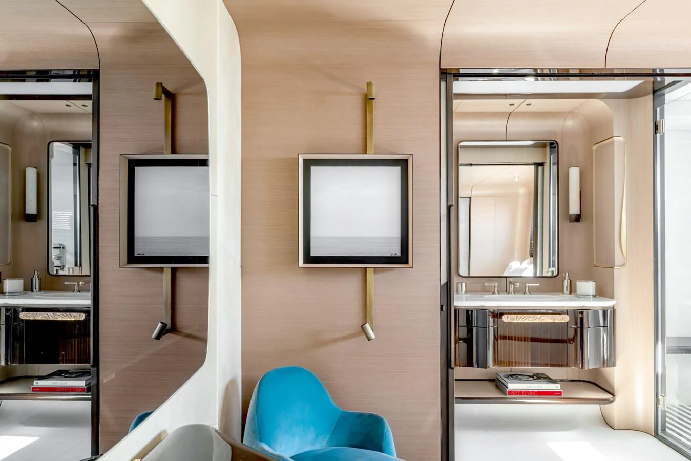 a room with a tv and a chair aboard CLUB M Yacht for Sale