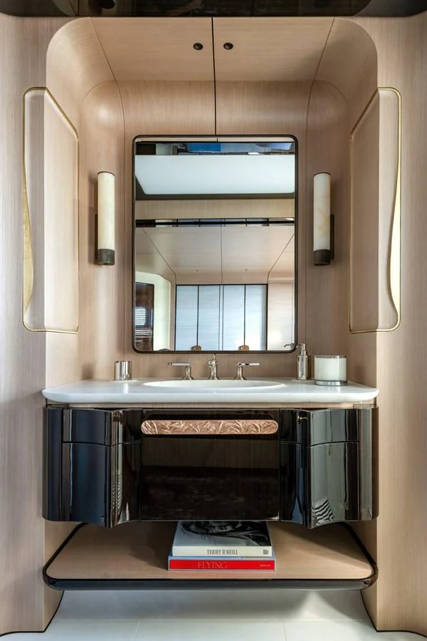 a bathroom with a mirror and a sink aboard CLUB M Yacht for Sale