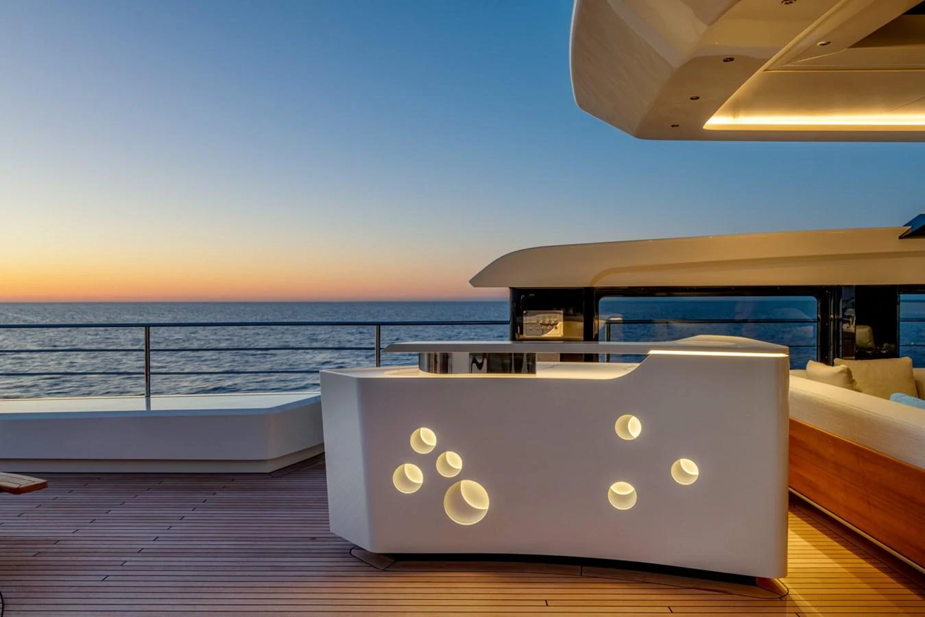 a laptop on a deck aboard CLUB M Yacht for Sale