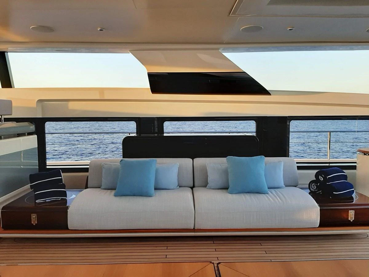a couch in a room aboard CLUB M Yacht for Sale