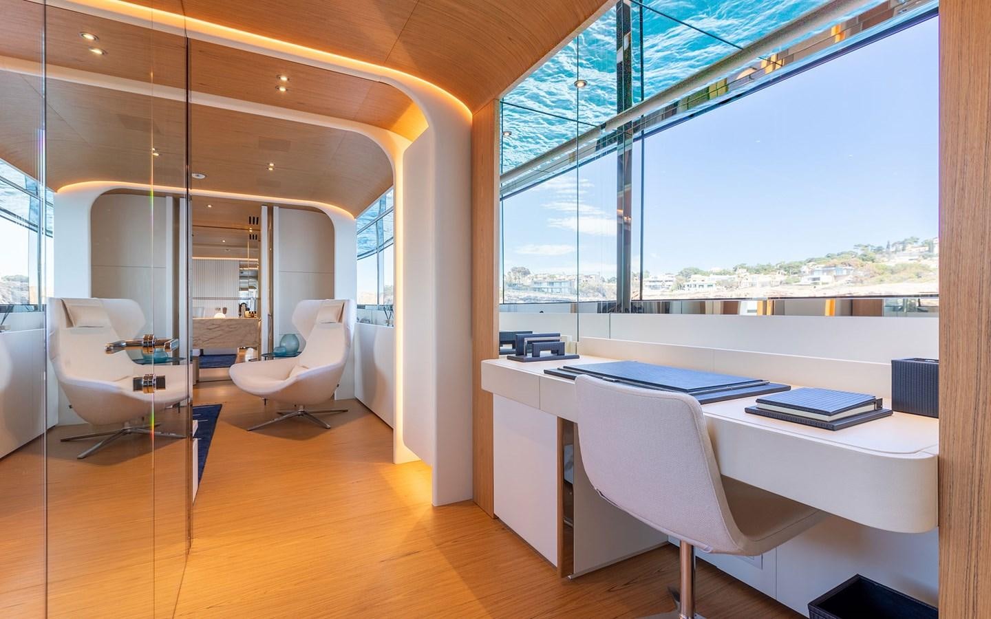 a room with a table chairs and a window aboard EH2 Yacht for Sale