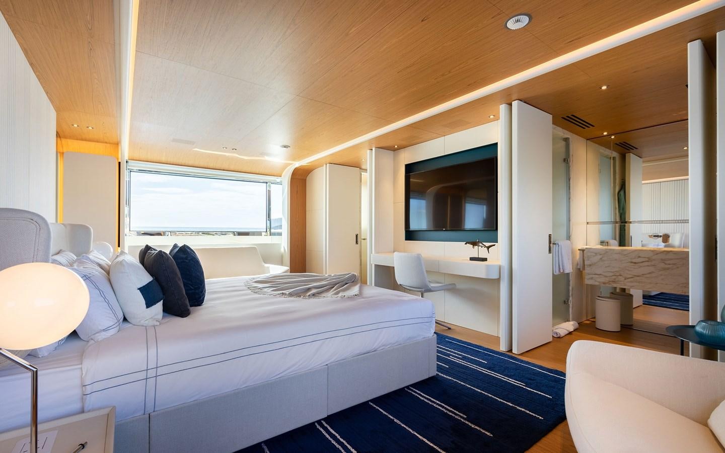a room with a bed and a window aboard EH2 Yacht for Sale