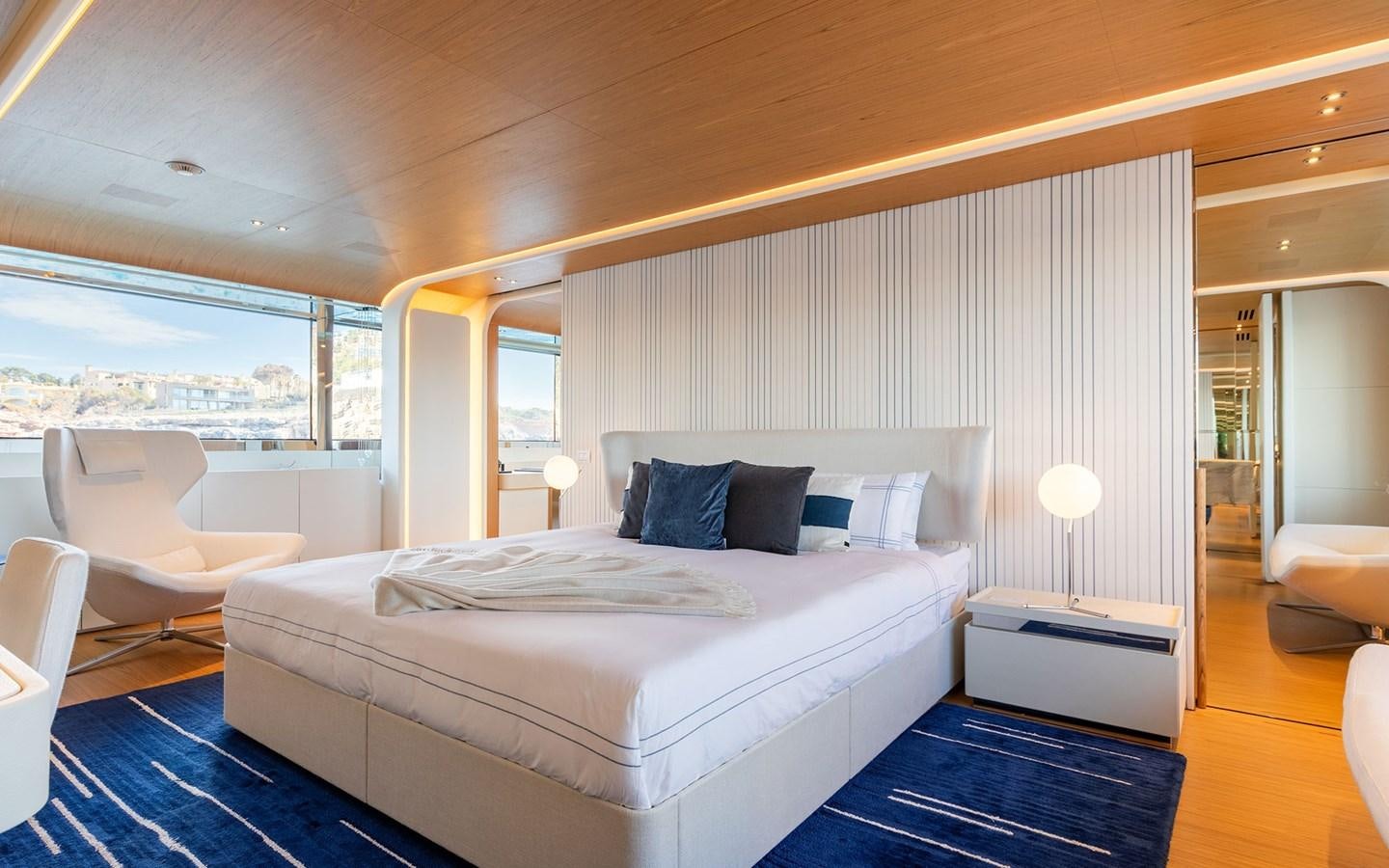 a large bedroom with a large bed aboard EH2 Yacht for Sale
