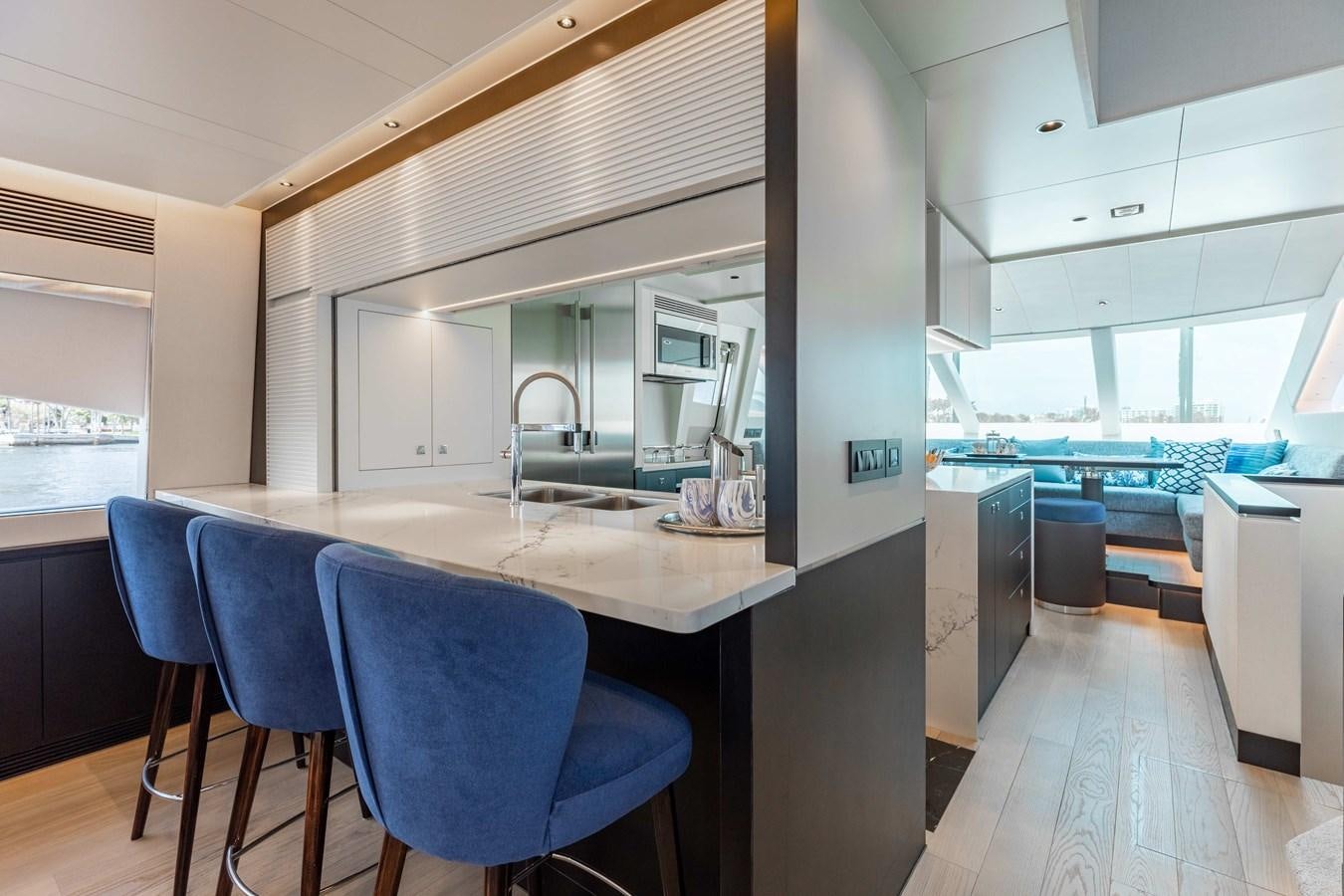 a room with a table and chairs aboard E90 MOTOR Yacht for Sale
