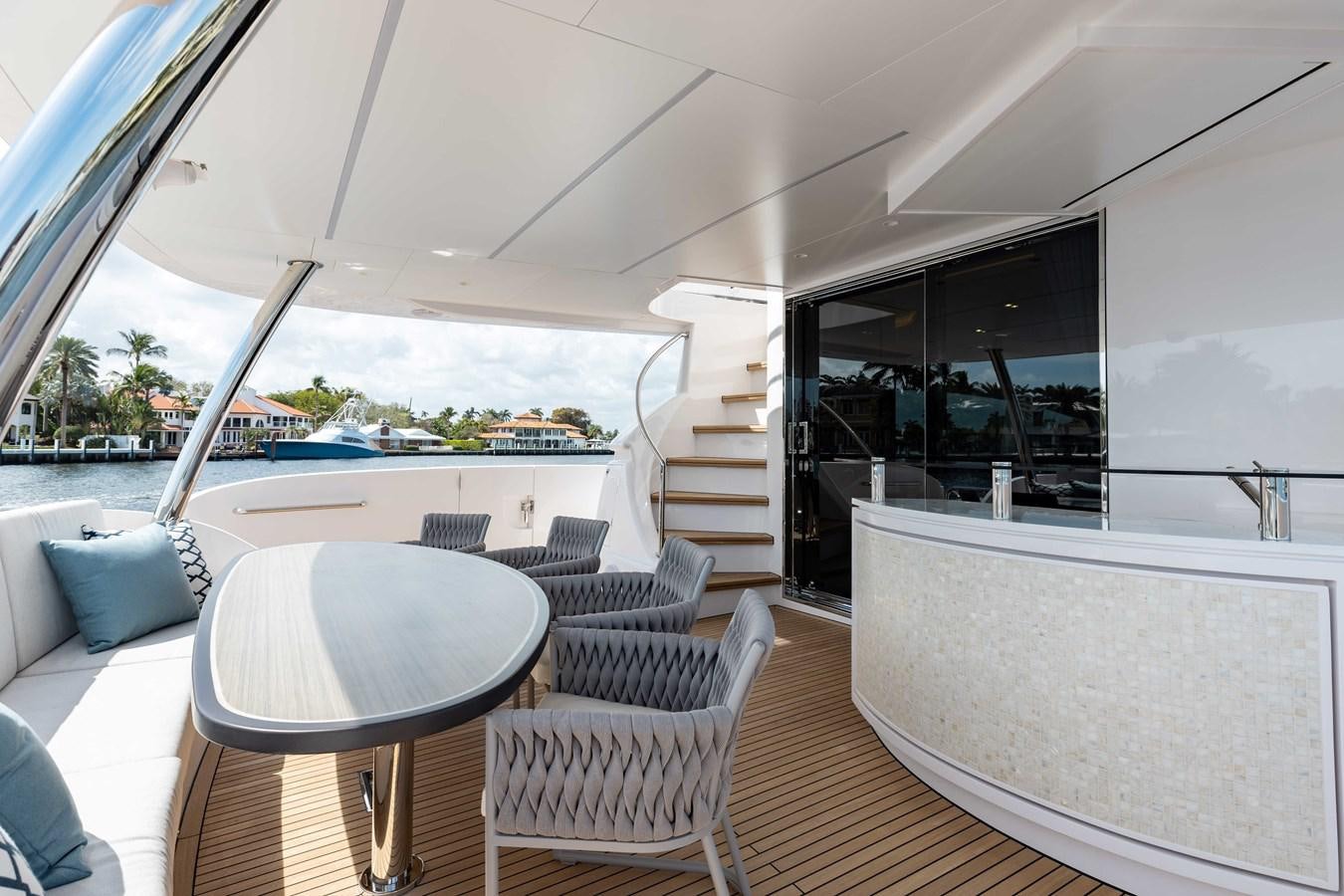 a room with a table chairs and a large window aboard E90 MOTOR Yacht for Sale
