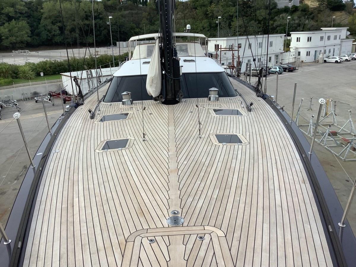 a large white boat on a dock aboard GUARDIAN ANGEL Yacht for Sale
