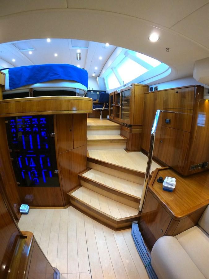 a room with a bed and a table aboard GUARDIAN ANGEL Yacht for Sale