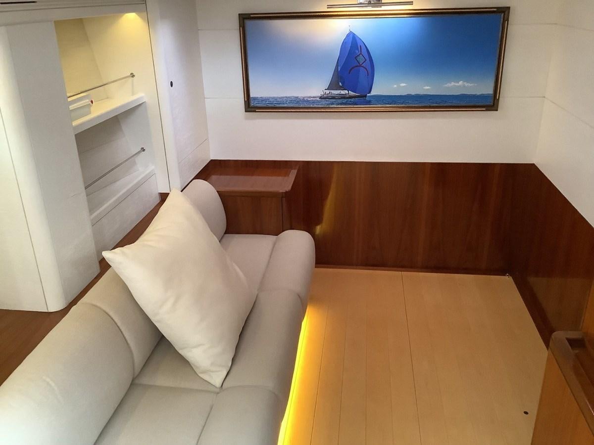 a couch and a television in a room aboard GUARDIAN ANGEL Yacht for Sale
