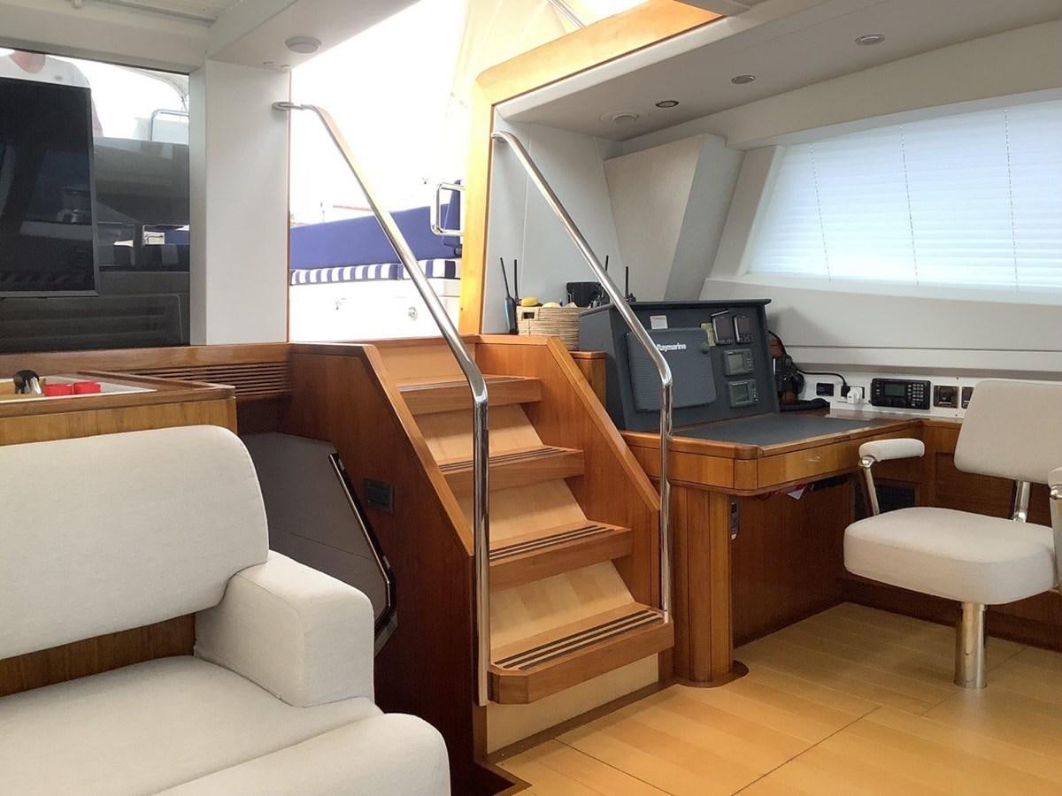 a room with a couch and a desk aboard GUARDIAN ANGEL Yacht for Sale