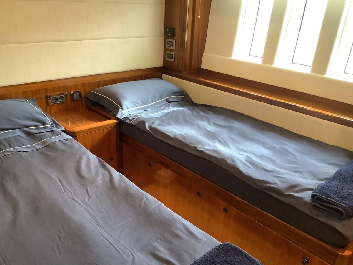 a couple of beds in a room aboard GUARDIAN ANGEL Yacht for Sale