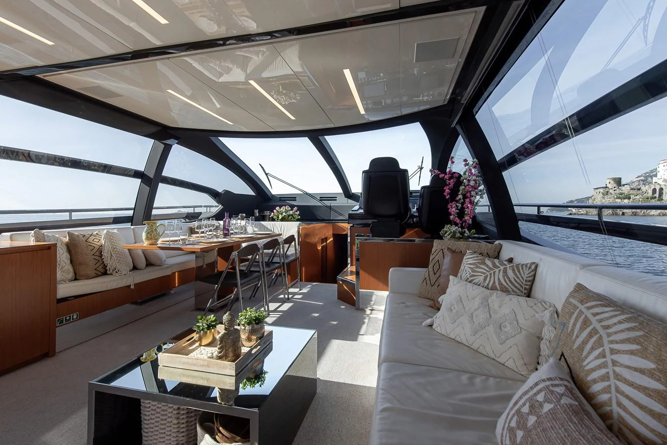 a living room with a large window aboard SOUL Yacht for Sale