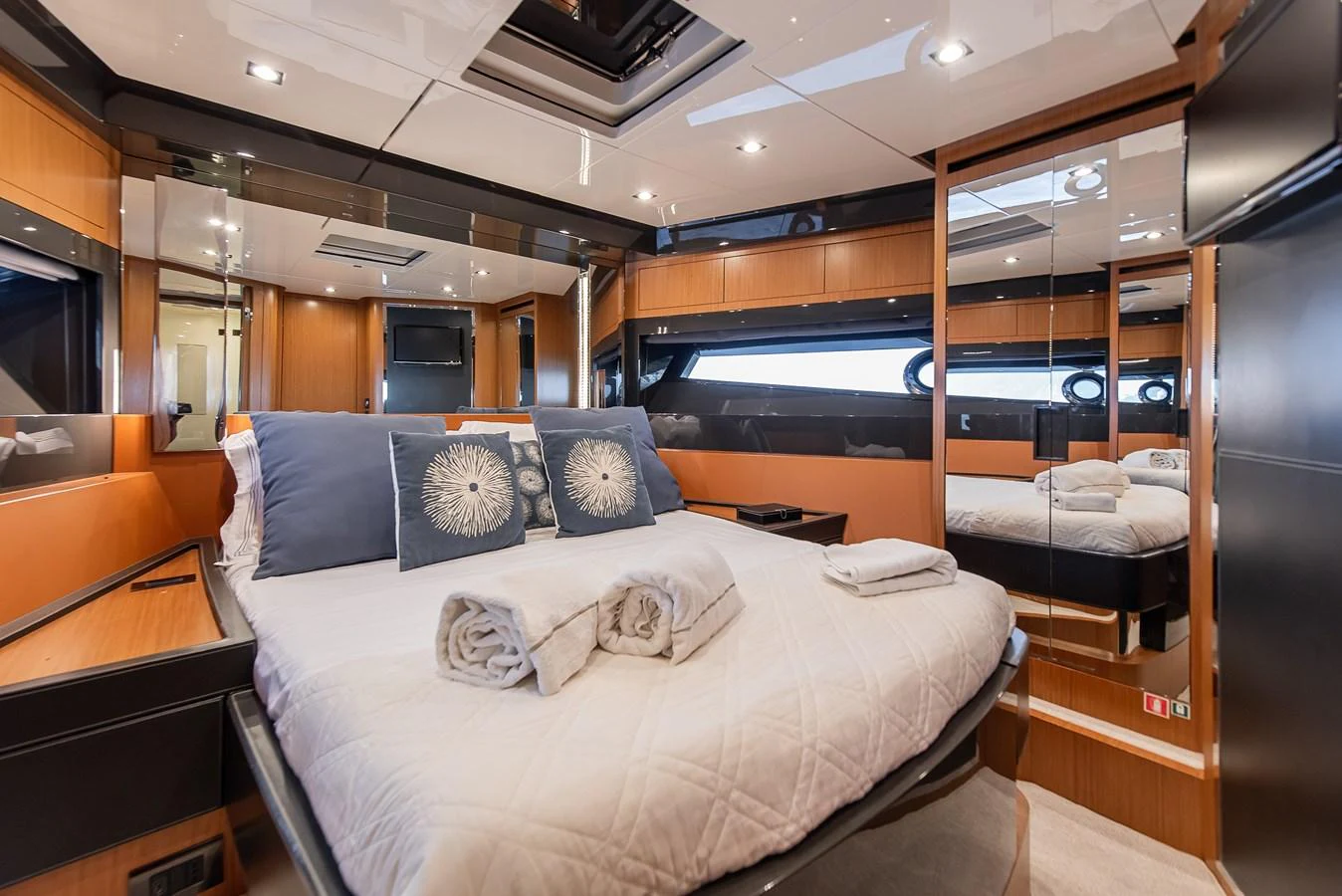 a room with a bed and a desk aboard SOUL Yacht for Sale