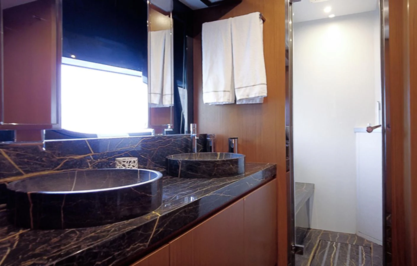a bathroom with a tub and a sink aboard SOUL Yacht for Sale