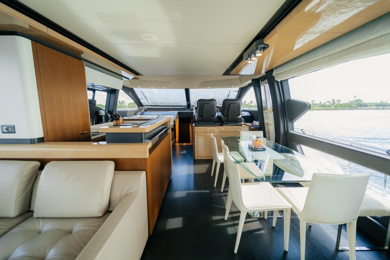 a room with a table and chairs aboard VENTURE Yacht for Sale