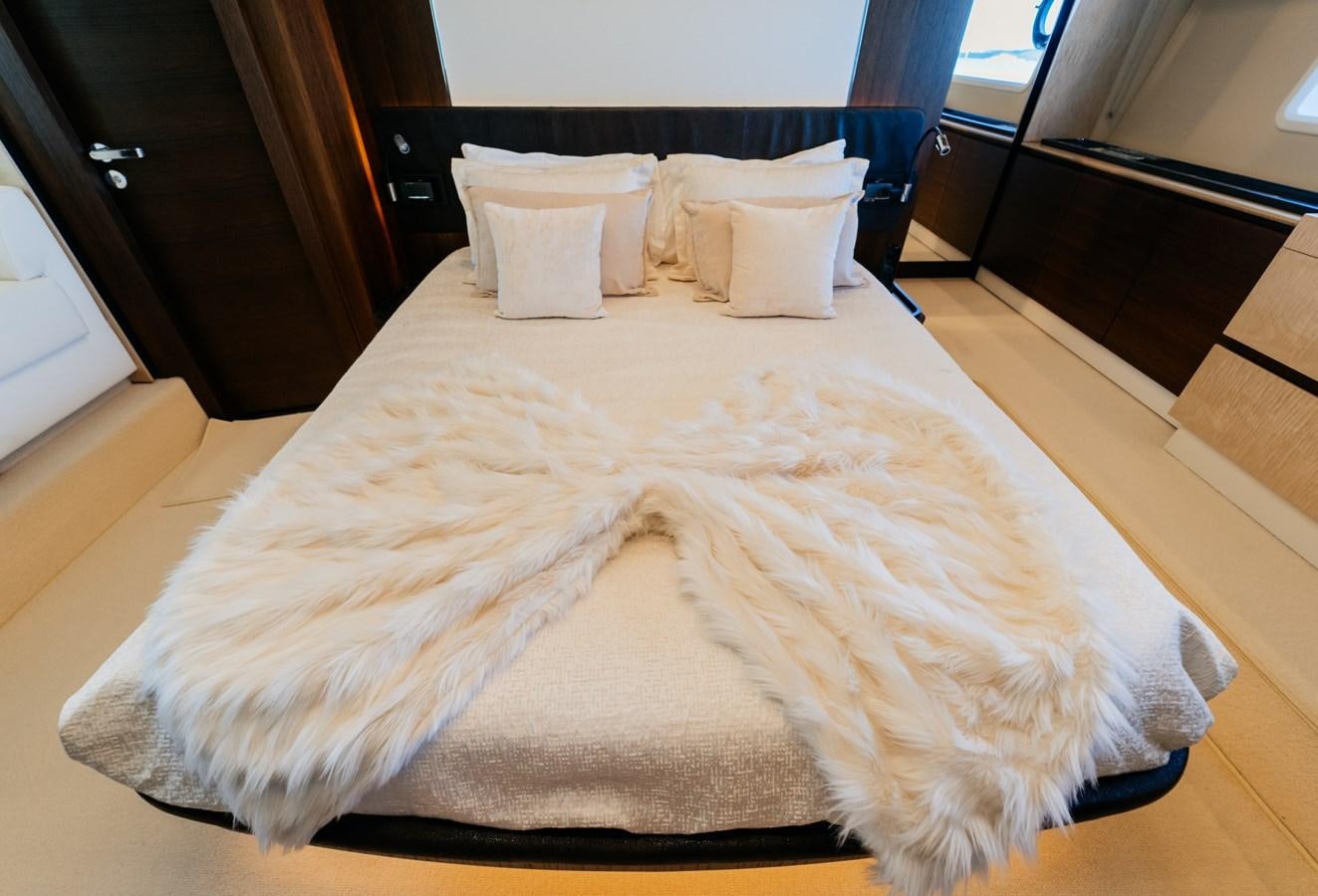 a bed with white sheets aboard VENTURE Yacht for Sale