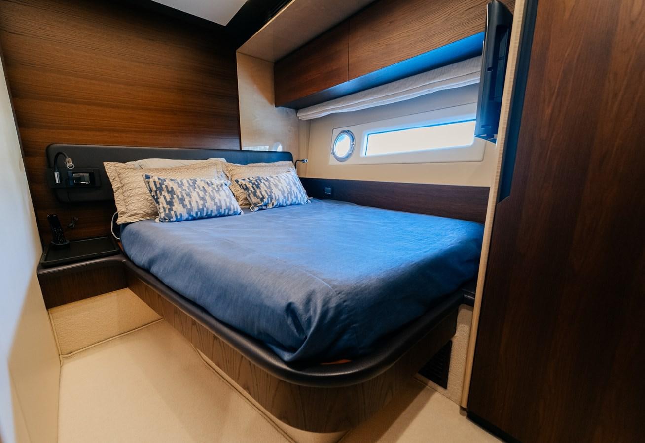 a bed in a room aboard VENTURE Yacht for Sale