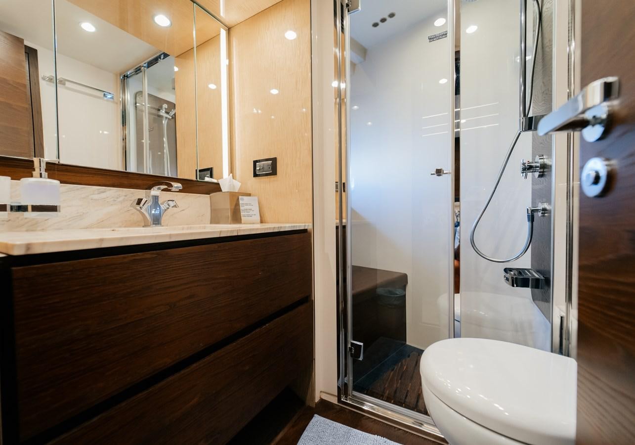 a bathroom with a glass shower aboard VENTURE Yacht for Sale