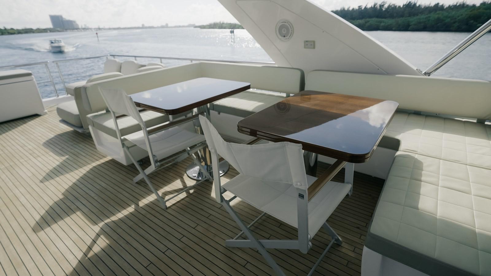a deck with chairs on it aboard VENTURE Yacht for Sale