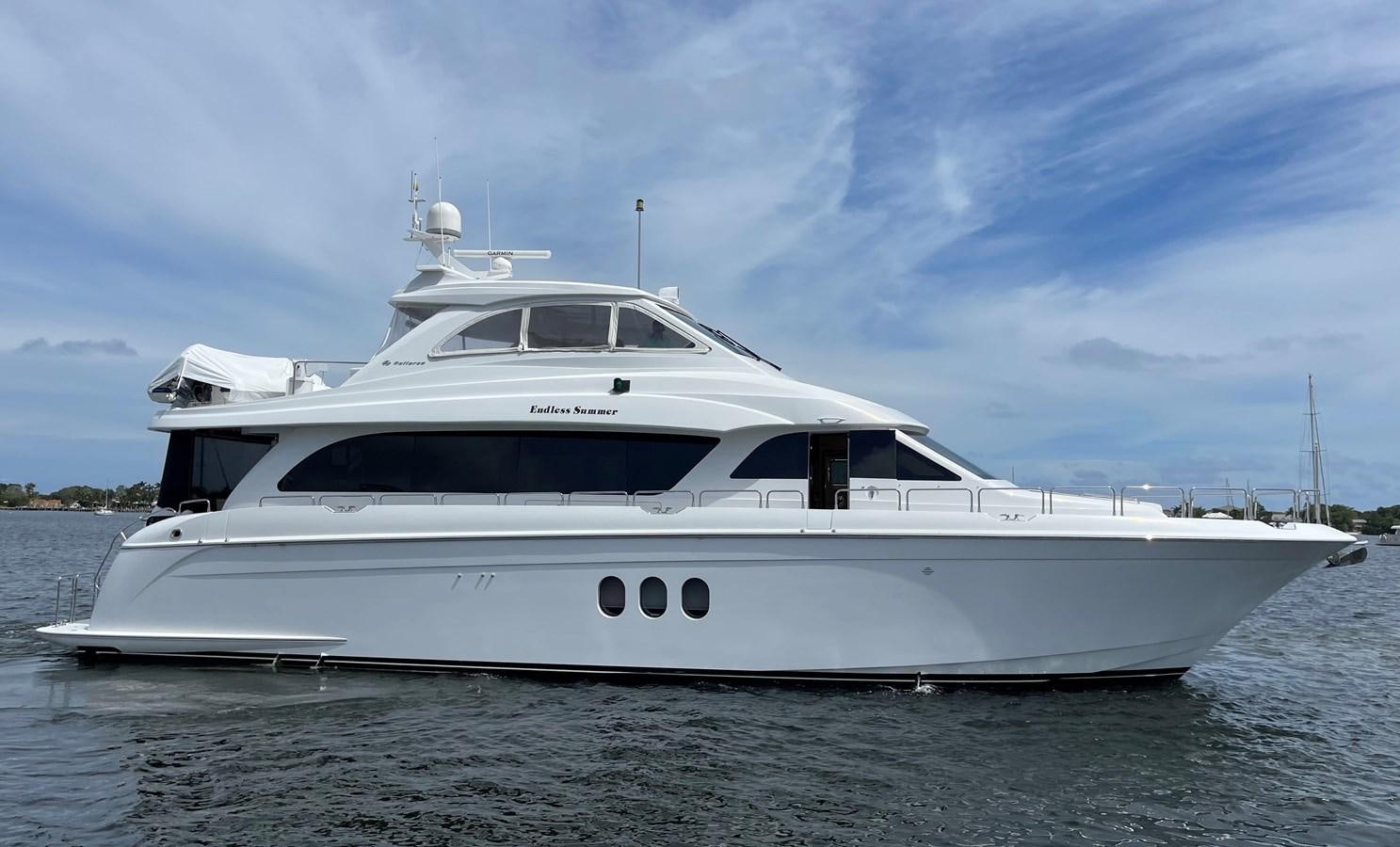 a white yacht on a beach aboard ENDLESS SUMMER Yacht for Sale
