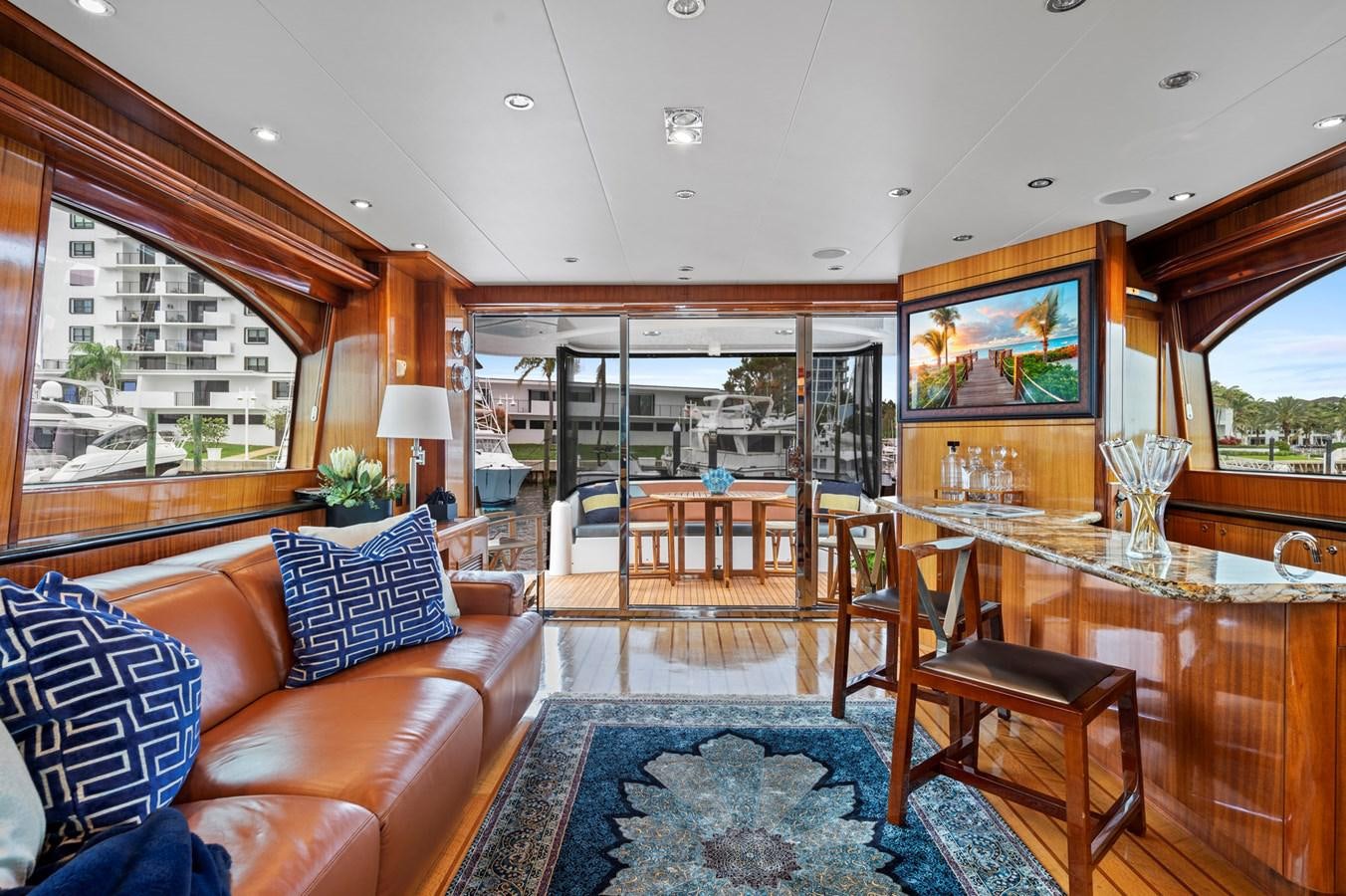 a living room with a large glass window aboard ENDLESS SUMMER Yacht for Sale