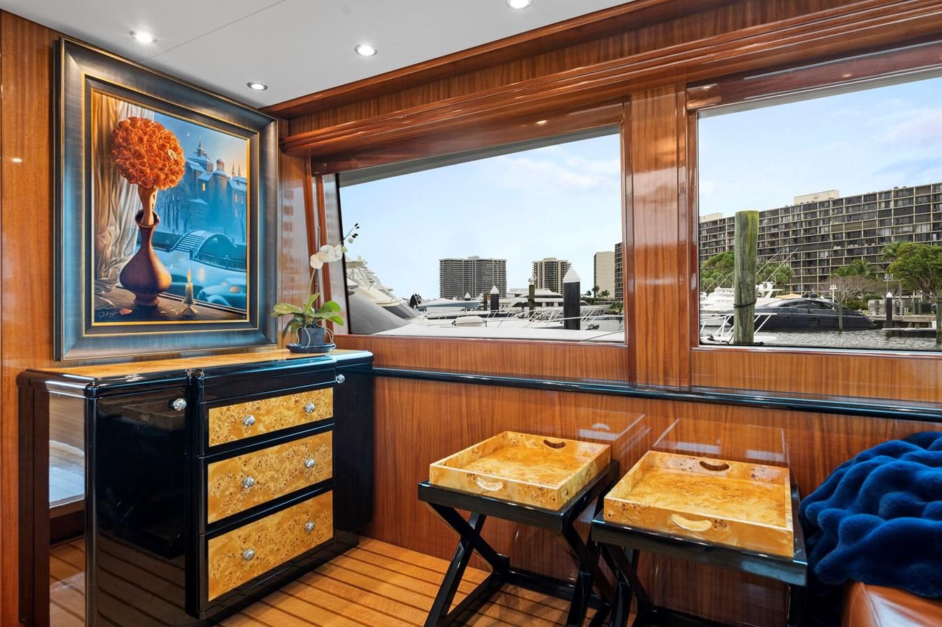a room with a painting on the wall and a desk with a painting on it aboard ENDLESS SUMMER Yacht for Sale