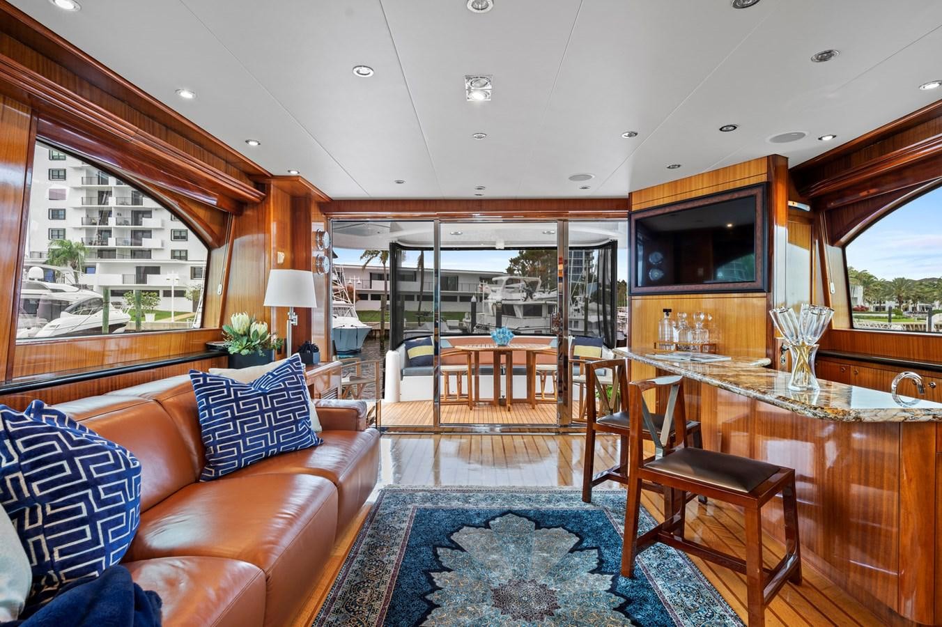 a living room with a large glass table and a large window aboard ENDLESS SUMMER Yacht for Sale