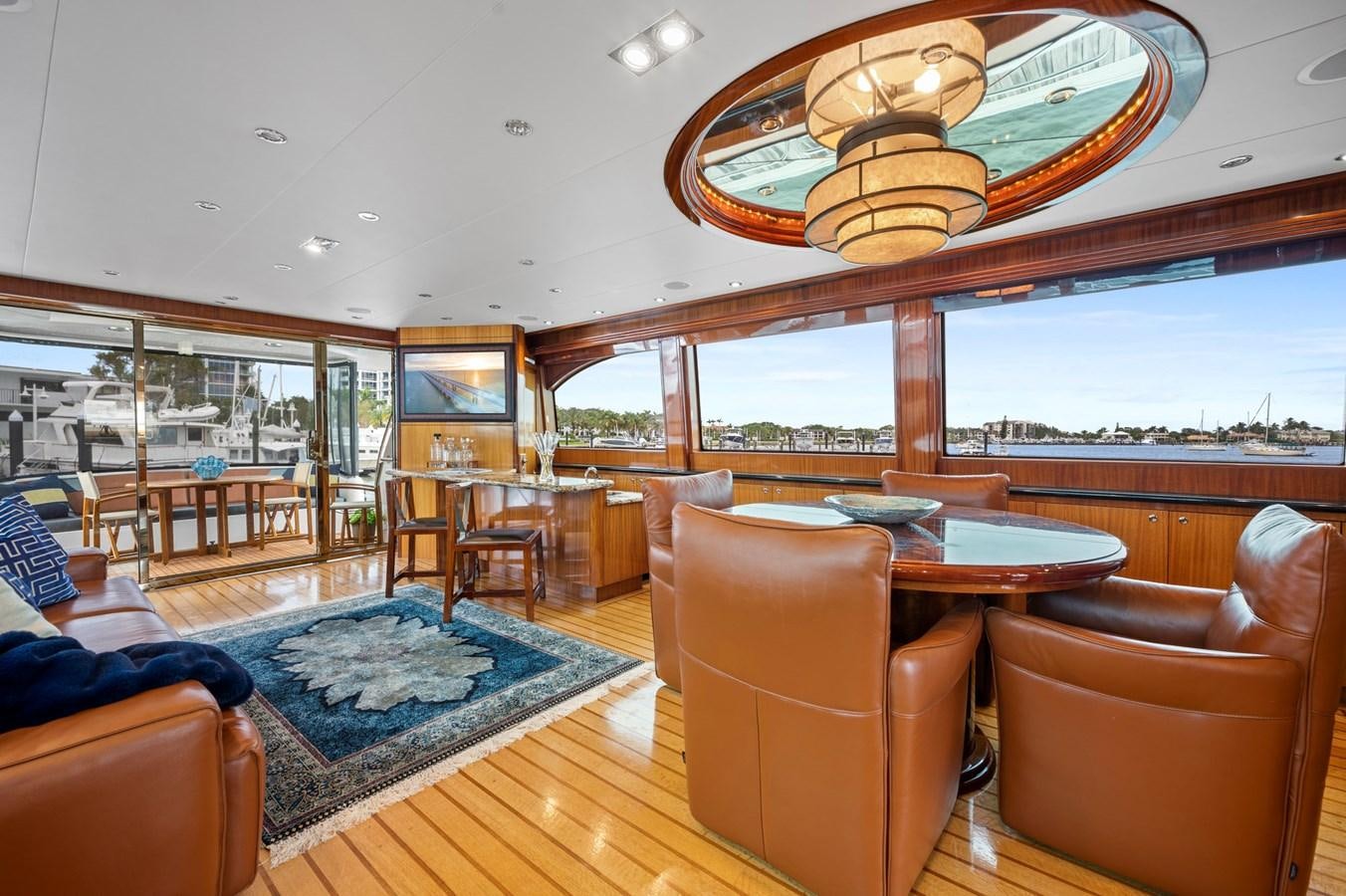 a large room with a table and chairs aboard ENDLESS SUMMER Yacht for Sale