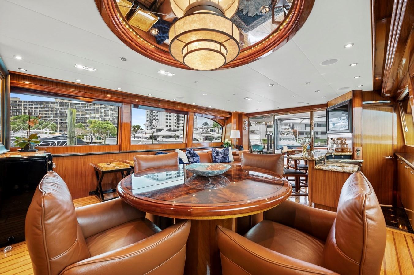a living room with a table and chairs aboard ENDLESS SUMMER Yacht for Sale