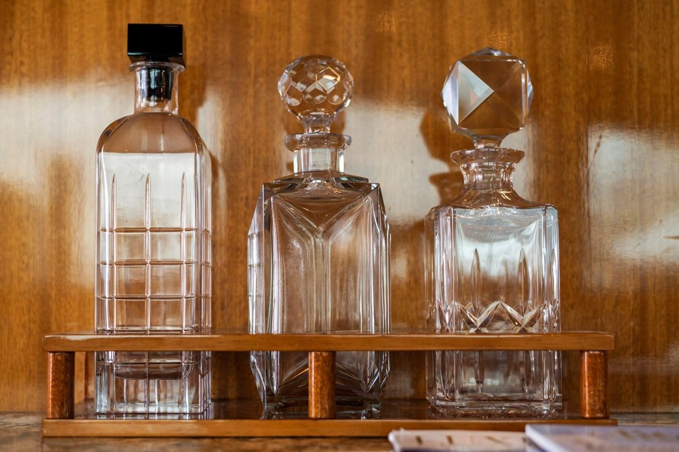 a few antique bottles on a shelf aboard ENDLESS SUMMER Yacht for Sale