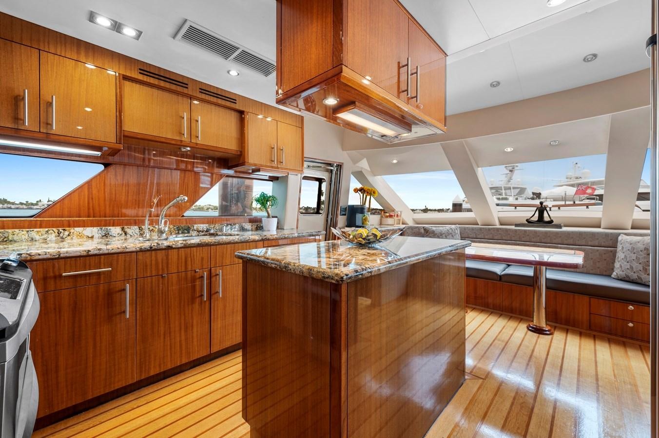 a kitchen with wooden cabinets aboard ENDLESS SUMMER Yacht for Sale