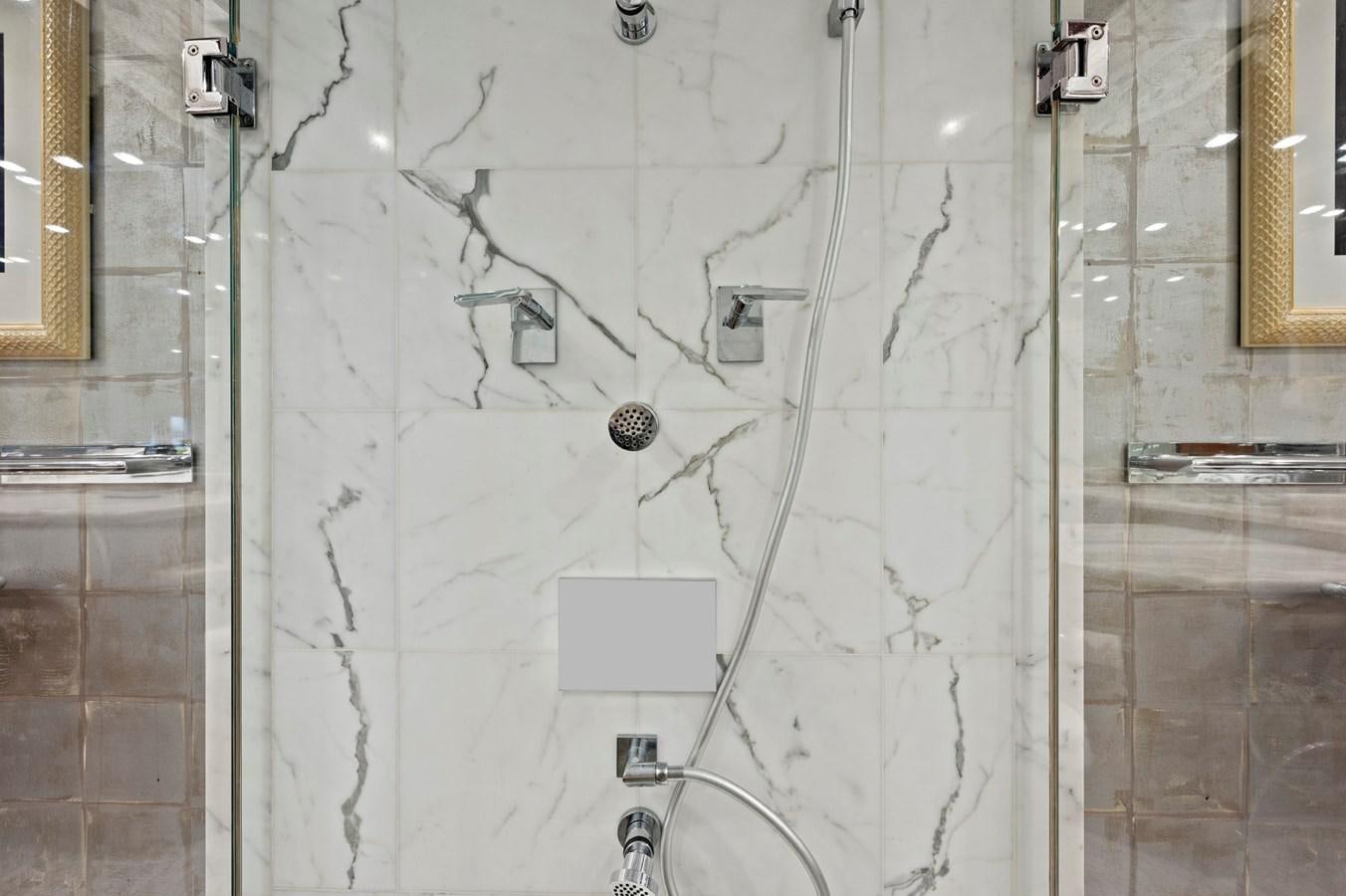 a white tiled bathroom aboard ENDLESS SUMMER Yacht for Sale