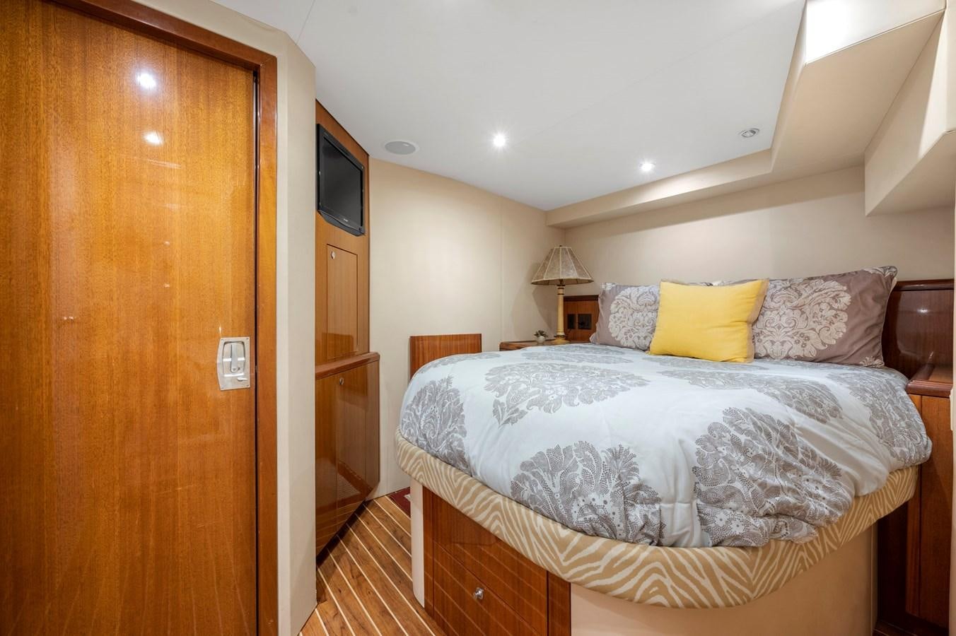 a bed with a white comforter aboard ENDLESS SUMMER Yacht for Sale