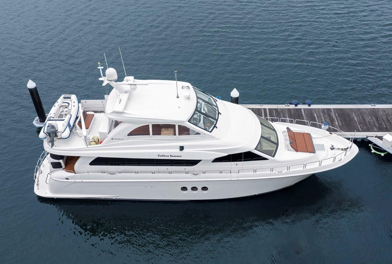 a white yacht on the water aboard ENDLESS SUMMER Yacht for Sale